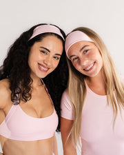 Pink headbands and sports bras